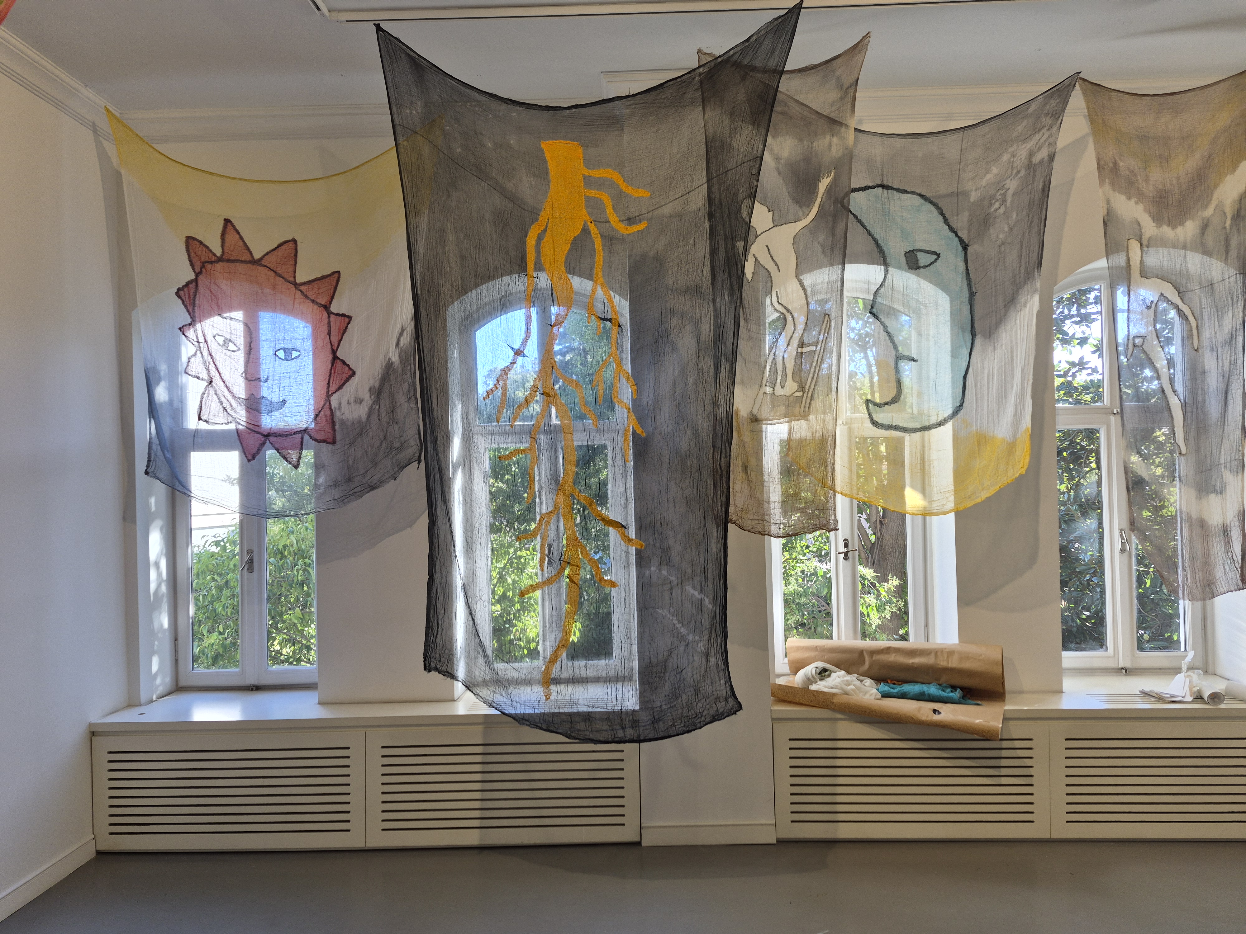 Installation view of textile works in an exhibition space